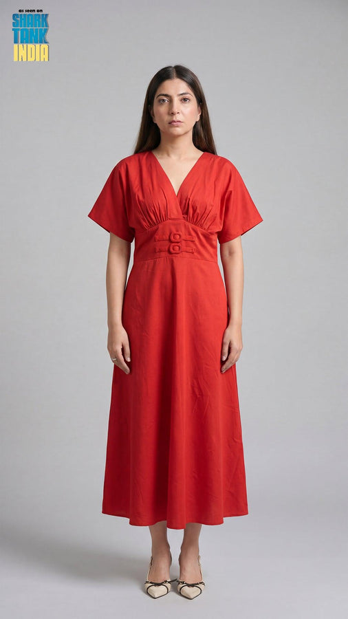 Woman wearing a red dress against a gray background