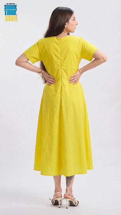 Woman wearing a yellow dress on a white background
