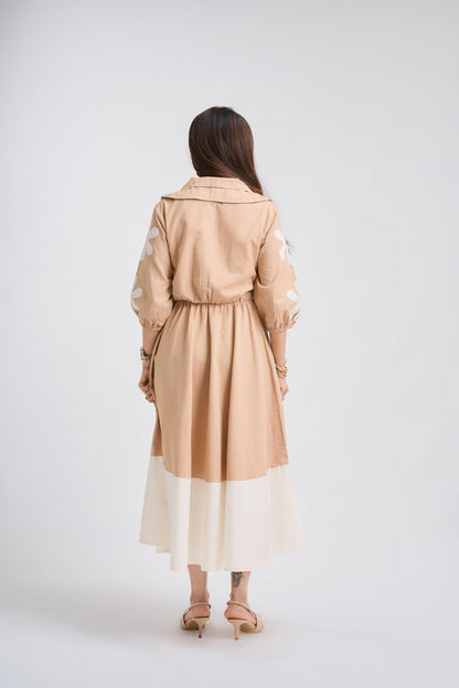 Woman wearing a beige trench coat on a white background