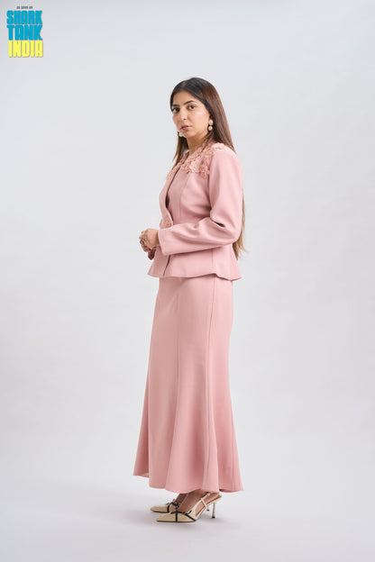 Woman wearing a pink suit on a white background